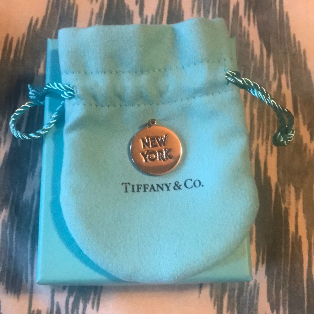 Round “New York” charm by Tiffany & Co.   BrandNew